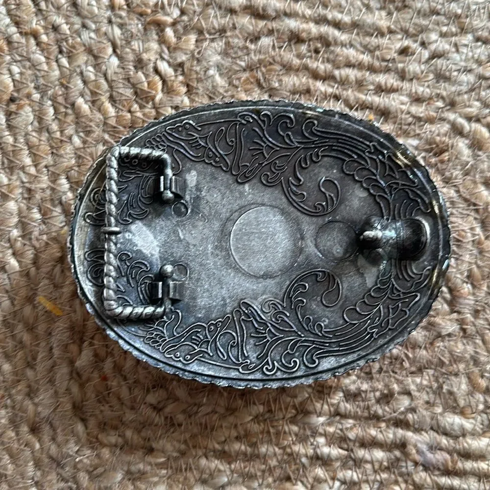 Handmade Coral Cherub belt buckle. One-of-a-kind.